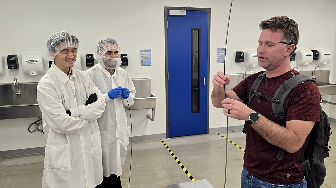 Cleanroom team reviewing a device