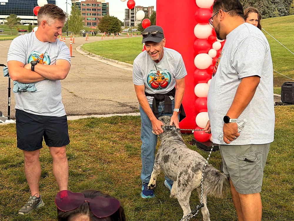 Team and a four-legged walker at the start line