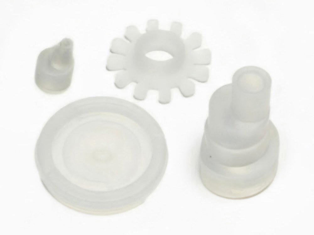 Molded silicone valve and seal components